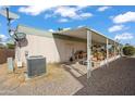 Mobile home with covered patio and AC unit at 5201 W Camelback Rd # 204, Phoenix, AZ 85031