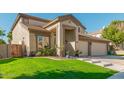 Two-story house with a three-car garage and lush landscaping at 959 W Myrtle Dr, Chandler, AZ 85248