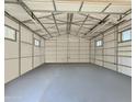 Large garage interior with high ceilings and a painted floor at 5414 S 10Th Ave, Phoenix, AZ 85041