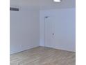 Simple living room featuring light walls and laminate flooring at 4901 E Magic Stone Dr, Phoenix, AZ 85044