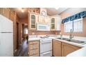 Updated kitchen featuring white cabinets and a convenient layout at 648 Hawks Eye Dr # 648, Apache Junction, AZ 85119