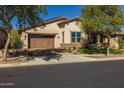 Single story home with a two car garage and front porch at 20960 W Mariposa St, Buckeye, AZ 85396