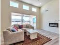 Spacious living room with fireplace and sliding glass doors at 9121 W Debbie Ln, Arizona City, AZ 85123