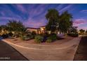 House exterior at night with corner view at 13431 W Los Bancos Dr, Sun City West, AZ 85375