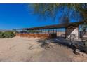 Property features a covered stable with multiple stalls and a storage shed at 1916 E Primrose Path, Phoenix, AZ 85086