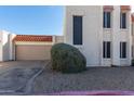 Townhouse exterior with attached garage and landscaping at 16053 N 26Th Cir, Phoenix, AZ 85023