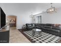 Spacious living room with sectional sofa and stylish coffee table at 26853 N 176Th Dr, Surprise, AZ 85387