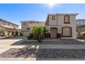 Two-story home with attached garage at 13635 W Calavar Rd, Surprise, AZ 85379
