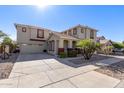 Two-story home with attached garage at 13635 W Calavar Rd, Surprise, AZ 85379
