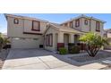 Two-story home with attached garage at 13635 W Calavar Rd, Surprise, AZ 85379