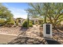 Spanish style home with a brick pathway and desert landscaping at 6717 E Solano Dr, Paradise Valley, AZ 85253