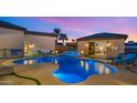 Luxury pool with spa and outdoor seating areas at 4519 E Meadowview Dr, Gilbert, AZ 85298