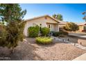 Tan house with landscaped yard and walkway at 907 E 9Th Ave, Mesa, AZ 85204