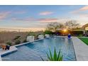 Inviting pool and spa area with sunset view at 8599 E Sand Flower Dr, Scottsdale, AZ 85266