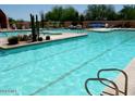 Community pool with lounge chairs and spa at 27808 N Desierto Dr, Rio Verde, AZ 85263