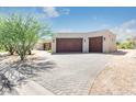 Two-car garage with brick paver driveway at 27808 N Desierto Dr, Rio Verde, AZ 85263