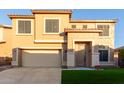 Two-story house with a two-car garage and artificial turf at 6321 S Teresa Dr, Chandler, AZ 85249