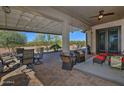 Covered patio with seating area, creating an inviting outdoor space at 4082 N Monticello Dr, Florence, AZ 85132