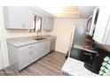 Modern kitchen with granite countertops and stainless steel appliances at 3119 W Cochise Dr # 106, Phoenix, AZ 85051
