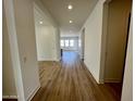 Bright hallway with wood-look flooring leading to other rooms at 3812 W Antelope Way, San Tan Valley, AZ 85144