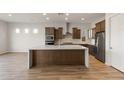 Modern kitchen with large island and stainless steel appliances at 22466 E San Tan Blvd, Queen Creek, AZ 85142