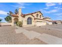 Two-story house with a three-car garage and desert landscaping at 2120 N 125Th Ave, Avondale, AZ 85392