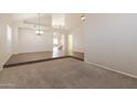 Spacious dining room with tile floors and a view of the staircase at 16847 S 13Th Way, Phoenix, AZ 85048
