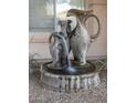 Ornate stone fountain with cascading water feature at 2541 E Carob Dr, Gilbert, AZ 85298