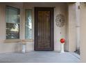 Inviting front entry with decorative door and accents at 2541 E Carob Dr, Gilbert, AZ 85298