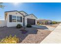 House exterior with landscaping and street view at 36063 W San Alvarez Ave, Maricopa, AZ 85138