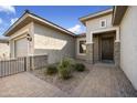 Front entry of a home with a dark brown door and stone accents at 10609 E Evergreen St, Mesa, AZ 85207