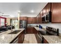 Well-equipped kitchen with stainless steel appliances and granite countertops at 23407 W Winslow Ave, Buckeye, AZ 85326