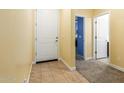 Entryway with tile floor and interior doors to other rooms at 23407 W Winslow Ave, Buckeye, AZ 85326