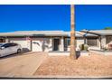 Front view of charming single-story home with attached garage and well-maintained landscaping at 7950 E Keats Ave # 130, Mesa, AZ 85209