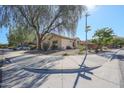 Single-story house with desert landscaping, driveway, and attached garage at 2521 W Oberlin Way, Phoenix, AZ 85085