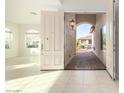 Open entryway with a view into the living area and backyard at 16513 W Windsor Ave, Goodyear, AZ 85395