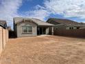 Large backyard with a view of a neighboring house at 20006 S 231St St, Queen Creek, AZ 85142