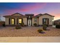 Ranch-style home with landscaped yard and curb appeal at 18577 W Coolidge St, Goodyear, AZ 85395