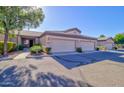 Well-maintained property with a two-car garage and desert landscaping at 846 N Pueblo Dr # 111, Casa Grande, AZ 85122