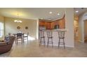 Kitchen features wood cabinets, granite countertops, and stainless steel appliances at 846 N Pueblo Dr # 111, Casa Grande, AZ 85122