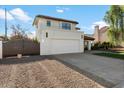 Two-story house with a brown gate and artificial turf front yard at 16008 N 56Th Way, Scottsdale, AZ 85254