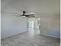 Bright living room with tile floors and ceiling fan at 3637 W Myrtle Ave, Phoenix, AZ 85051