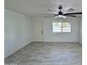 Living room featuring tile floors and a view of the front yard at 3637 W Myrtle Ave, Phoenix, AZ 85051