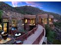 Mountainside home with stone exterior and a curved walkway at 5802 E Cholla Ln, Paradise Valley, AZ 85253