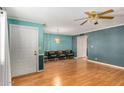 Light and airy living room with hardwood floors and a ceiling fan at 440 S Parkcrest -- # 36, Mesa, AZ 85206