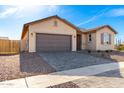 New single-story home with a two-car garage and driveway at 1171 E Ridgerock St, Casa Grande, AZ 85122