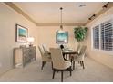 Elegant dining room with neutral color palette and ample natural light at 2717 W Nighthawk Way, Phoenix, AZ 85045