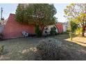 Brick home with a large backyard and mature trees at 3433 W Poinsettia Dr, Phoenix, AZ 85029