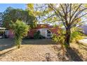 Brick home with a landscaped yard and circular driveway at 3433 W Poinsettia Dr, Phoenix, AZ 85029