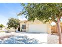 One-story home with attached garage and well-maintained yard at 34831 N Mashona Trl, San Tan Valley, AZ 85143